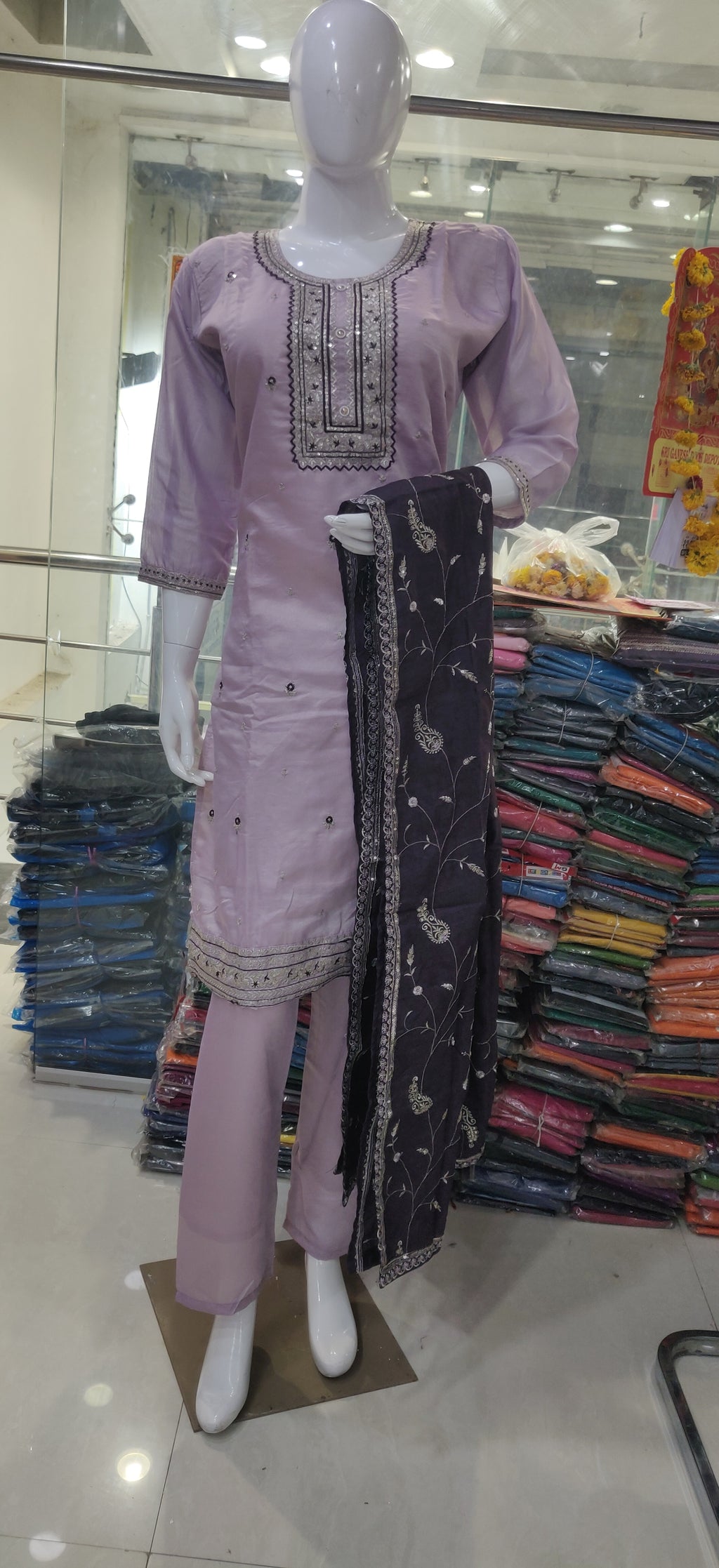 Elevate your ethnic wardrobe with this elegant light lavender-colored salwar kameez set