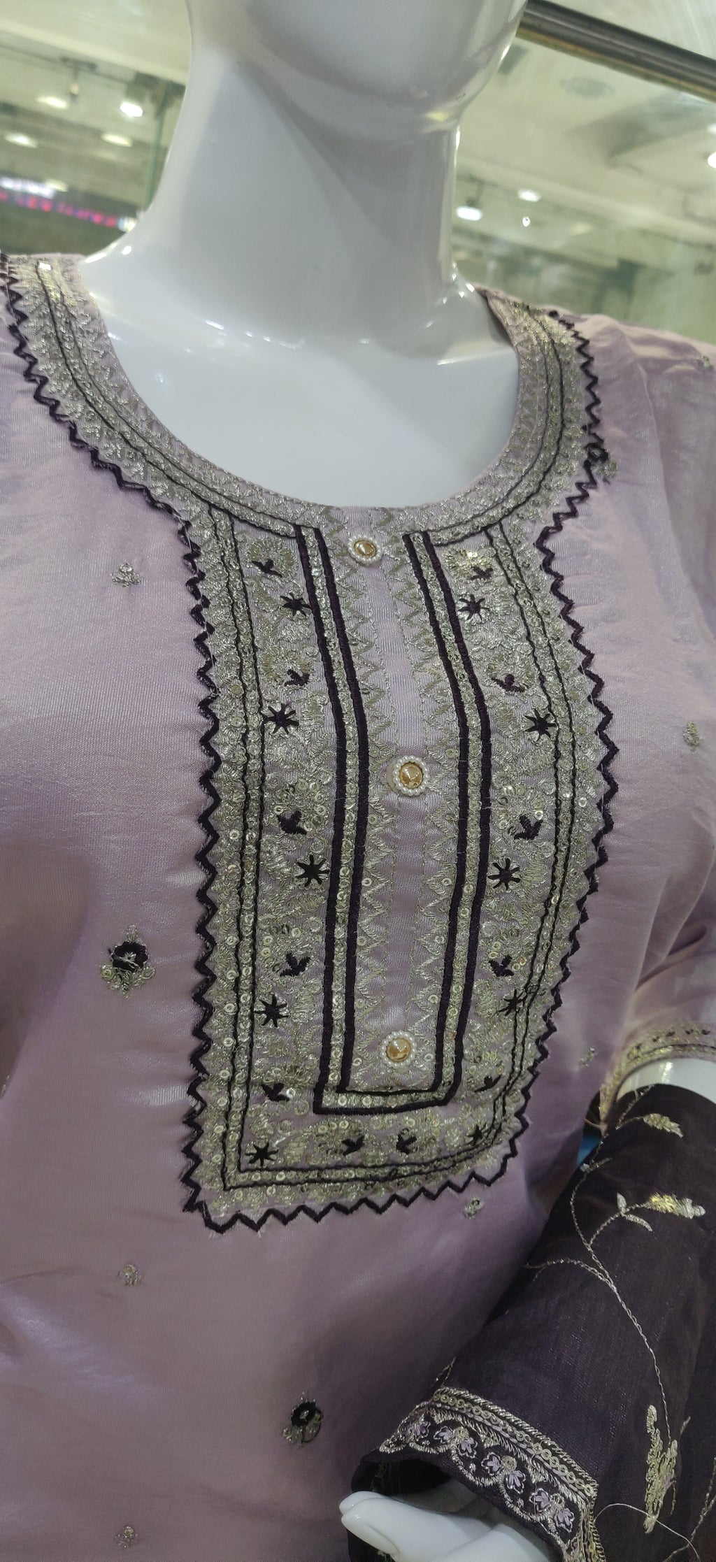Elevate your ethnic wardrobe with this elegant light lavender-colored salwar kameez set